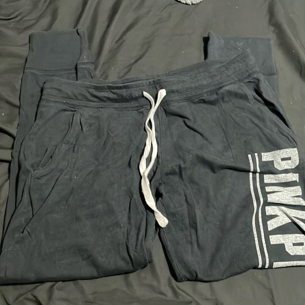 Black Victoria Secret PINK jogger capris with grey letters. Size large.